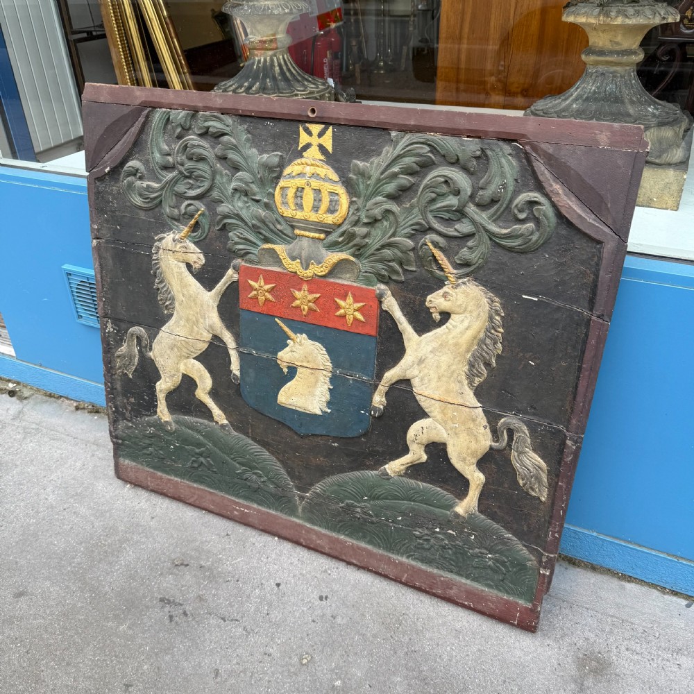 Carved coat of arms depicting unicorns View III