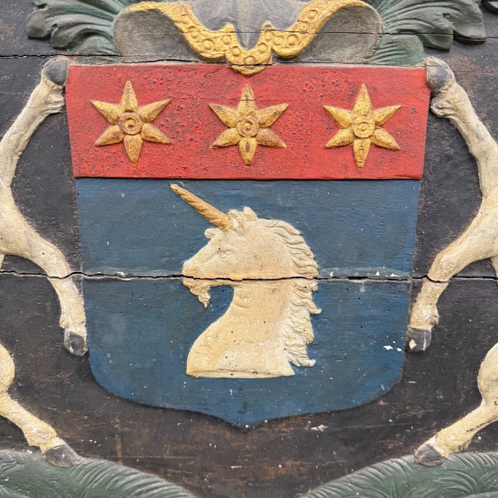 Carved coat of arms depicting unicorns View V