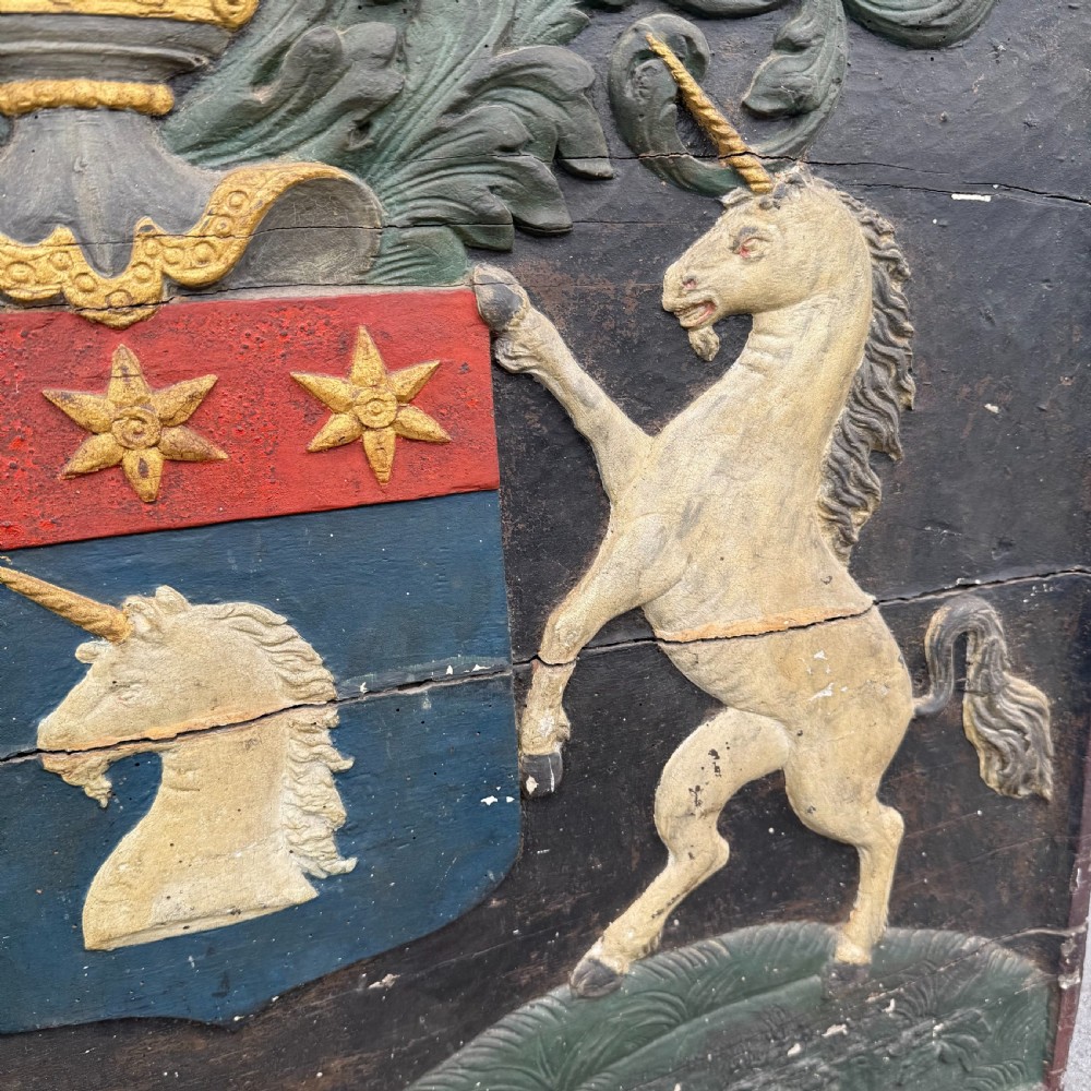 Carved coat of arms depicting unicorns View VI
