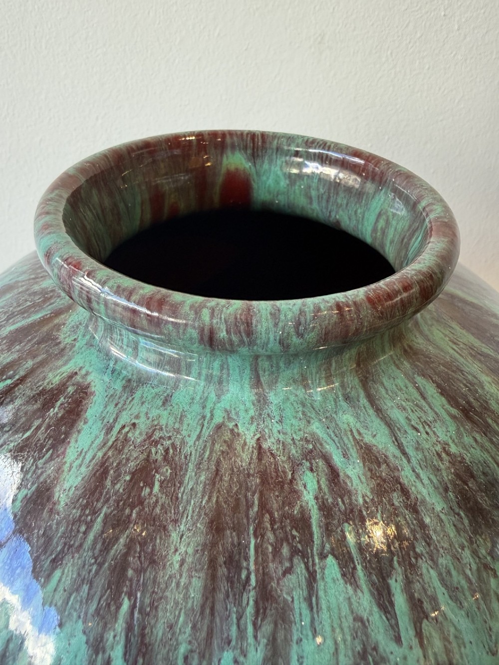 A large bulbous French ceramic vase featuring a dripped turquoise and deep red glossy glaze finish. View IV