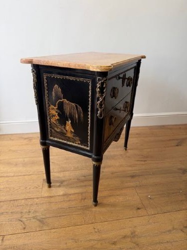 A pair of black lacquered Louis XVI style commodes featuring gold gilt Chinoiserie landscapes, marble tops, and tapered fluted legs. View IV