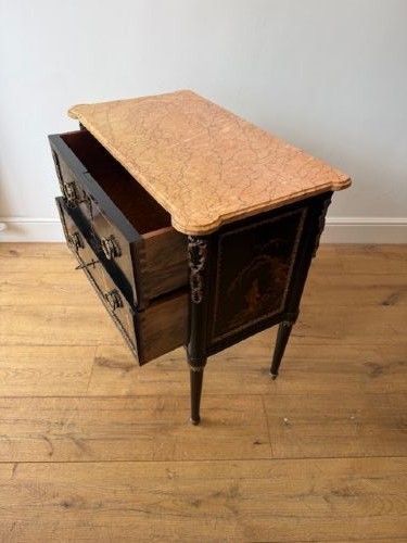 A pair of black lacquered Louis XVI style commodes featuring gold gilt Chinoiserie landscapes, marble tops, and tapered fluted legs. View VI