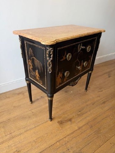 A pair of black lacquered Louis XVI style commodes featuring gold gilt Chinoiserie landscapes, marble tops, and tapered fluted legs. View V