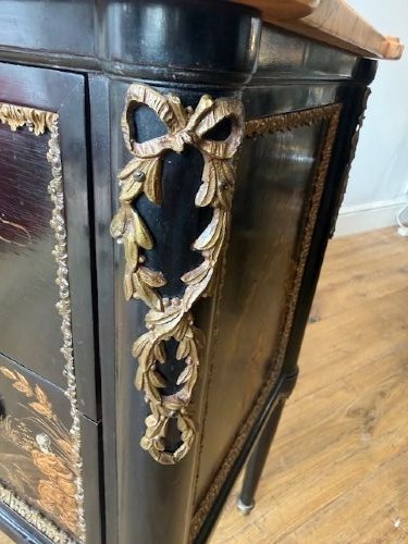 A pair of black lacquered Louis XVI style commodes featuring gold gilt Chinoiserie landscapes, marble tops, and tapered fluted legs. View IX