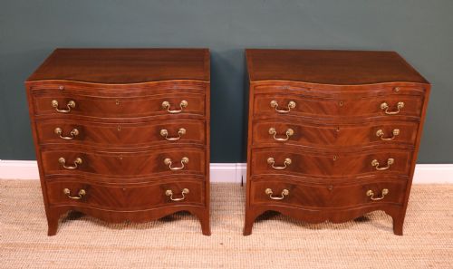 A Pair of George III Revival Serpentine Chest of Drawers