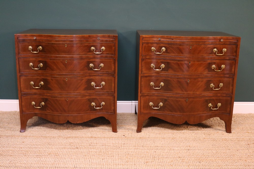 A Pair of George III Revival Serpentine Chest of Drawers View II