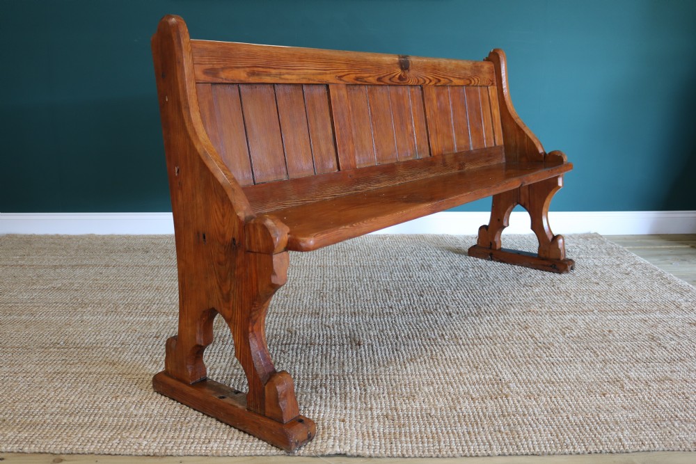 A Gothic Revival-style pine pew View VI