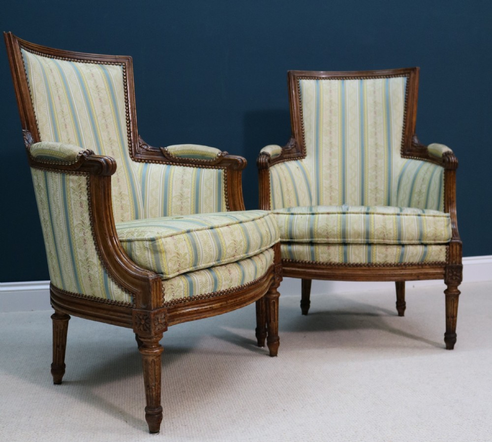 A pair of walnut fauteuil armchairs in French Louis XVI taste View VI