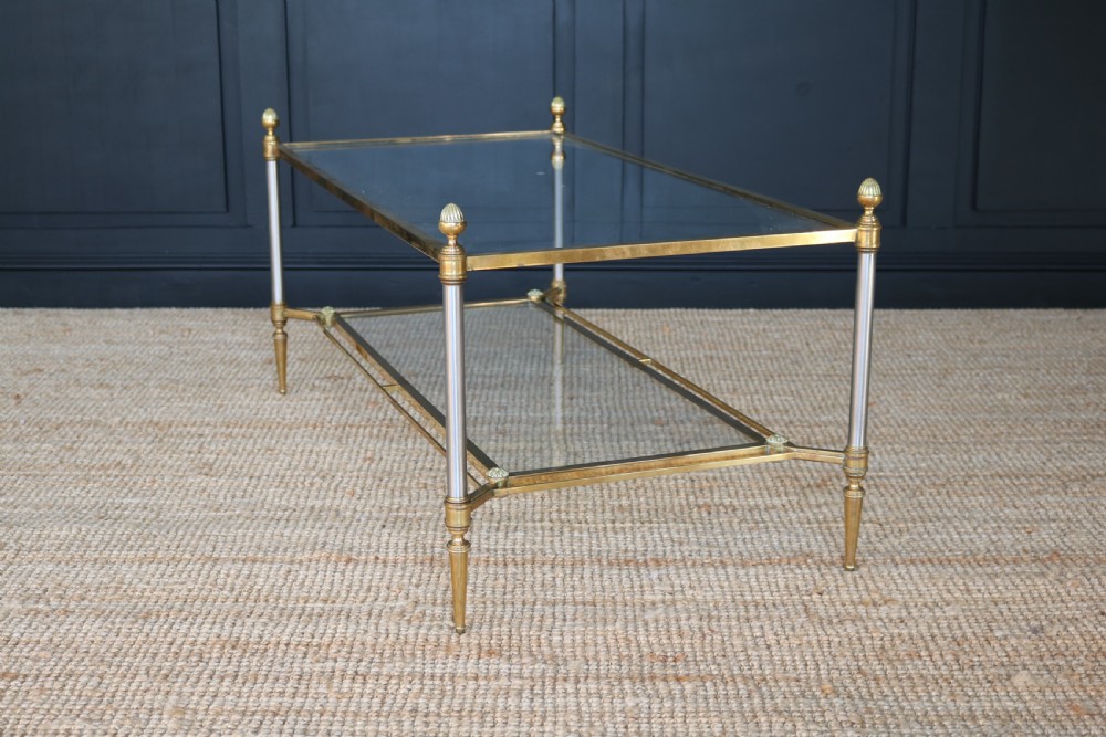 A two-tier rectangular brass and glass coffee table featuring finial corner posts and tapered legs. View II