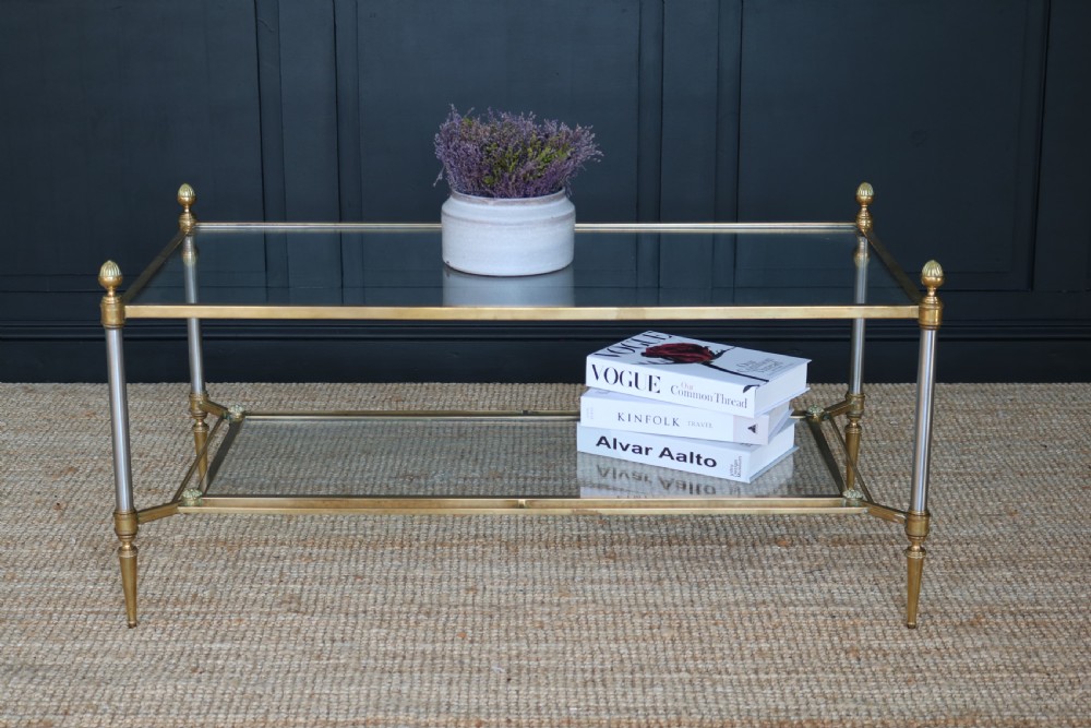 A two-tier rectangular brass and glass coffee table featuring finial corner posts and tapered legs. View III