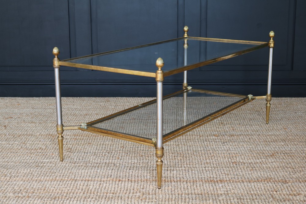 A two-tier rectangular brass and glass coffee table featuring finial corner posts and tapered legs. View IV