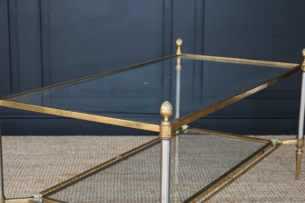 A two-tier rectangular brass and glass coffee table featuring finial corner posts and tapered legs. View V