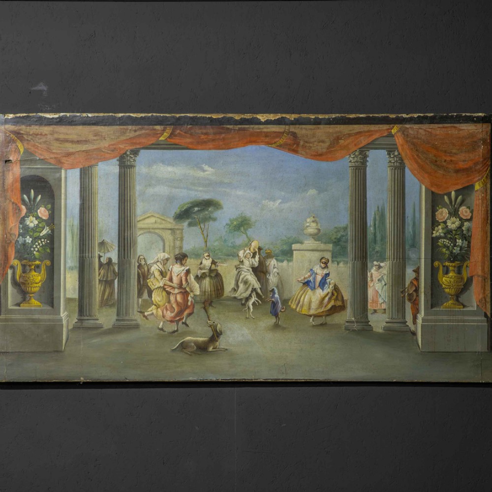A horizontal late Victorian oil painting depicting a theatrical stage with classical fluted columns, draped terracotta curtains, and costumed figures in an outdoor courtyard. View V