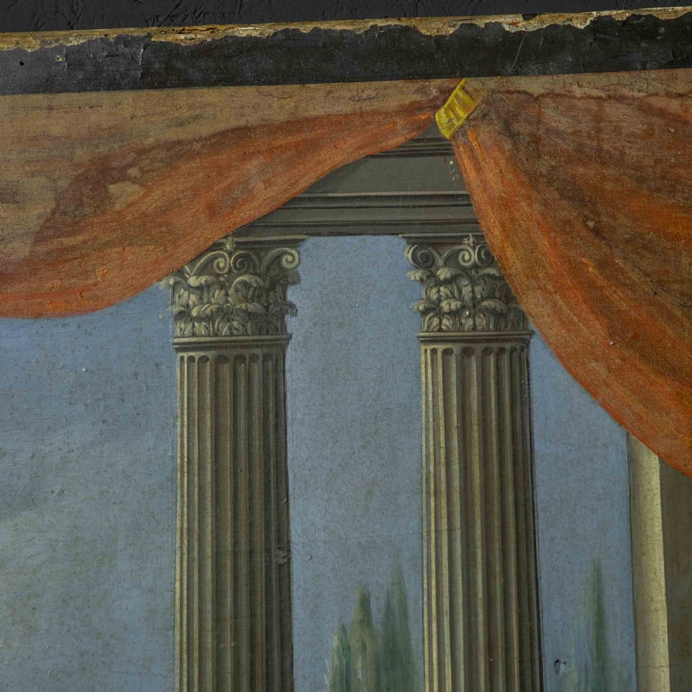 A horizontal late Victorian oil painting depicting a theatrical stage with classical fluted columns, draped terracotta curtains, and costumed figures in an outdoor courtyard. View XII