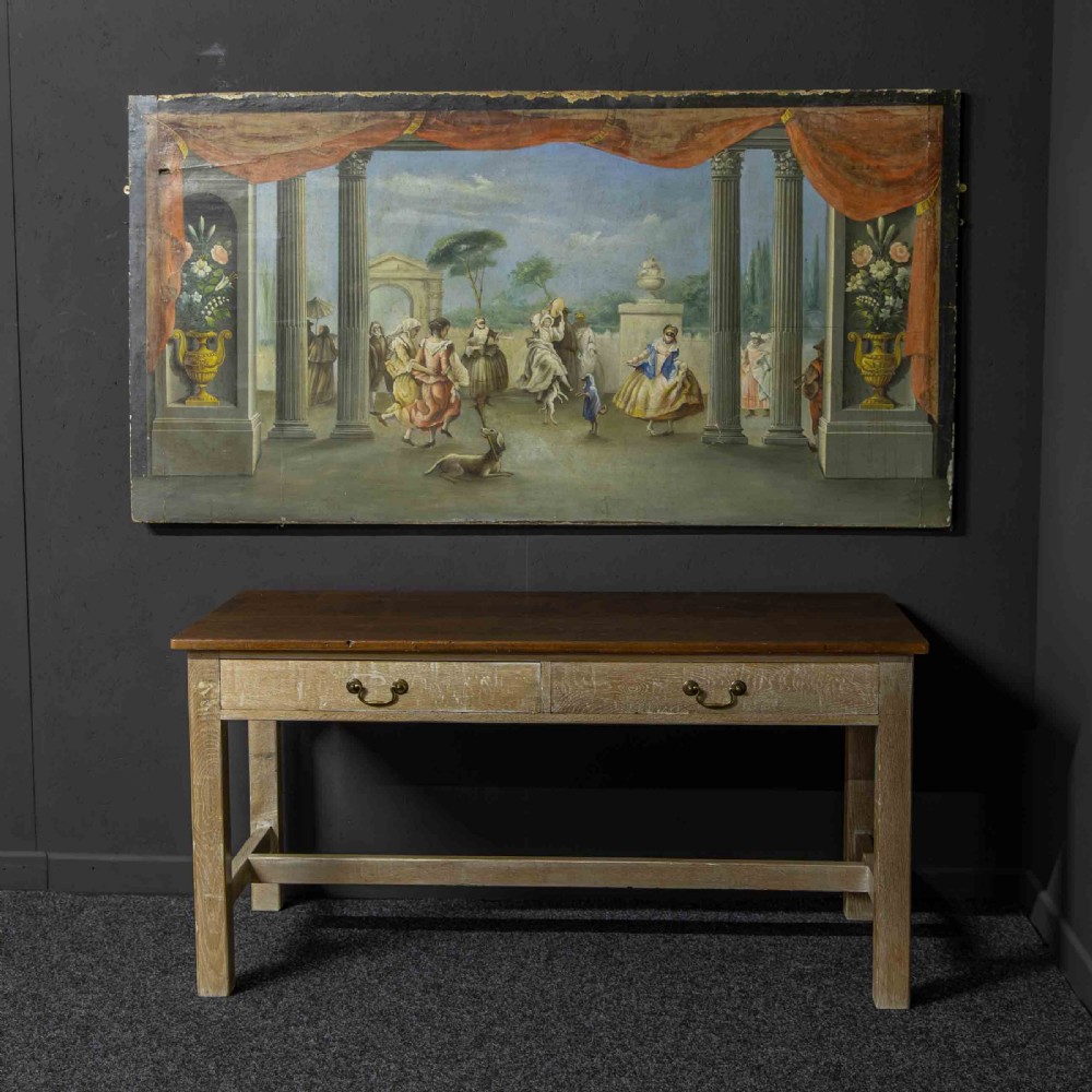 A horizontal late Victorian oil painting depicting a theatrical stage with classical fluted columns, draped terracotta curtains, and costumed figures in an outdoor courtyard. View XIV