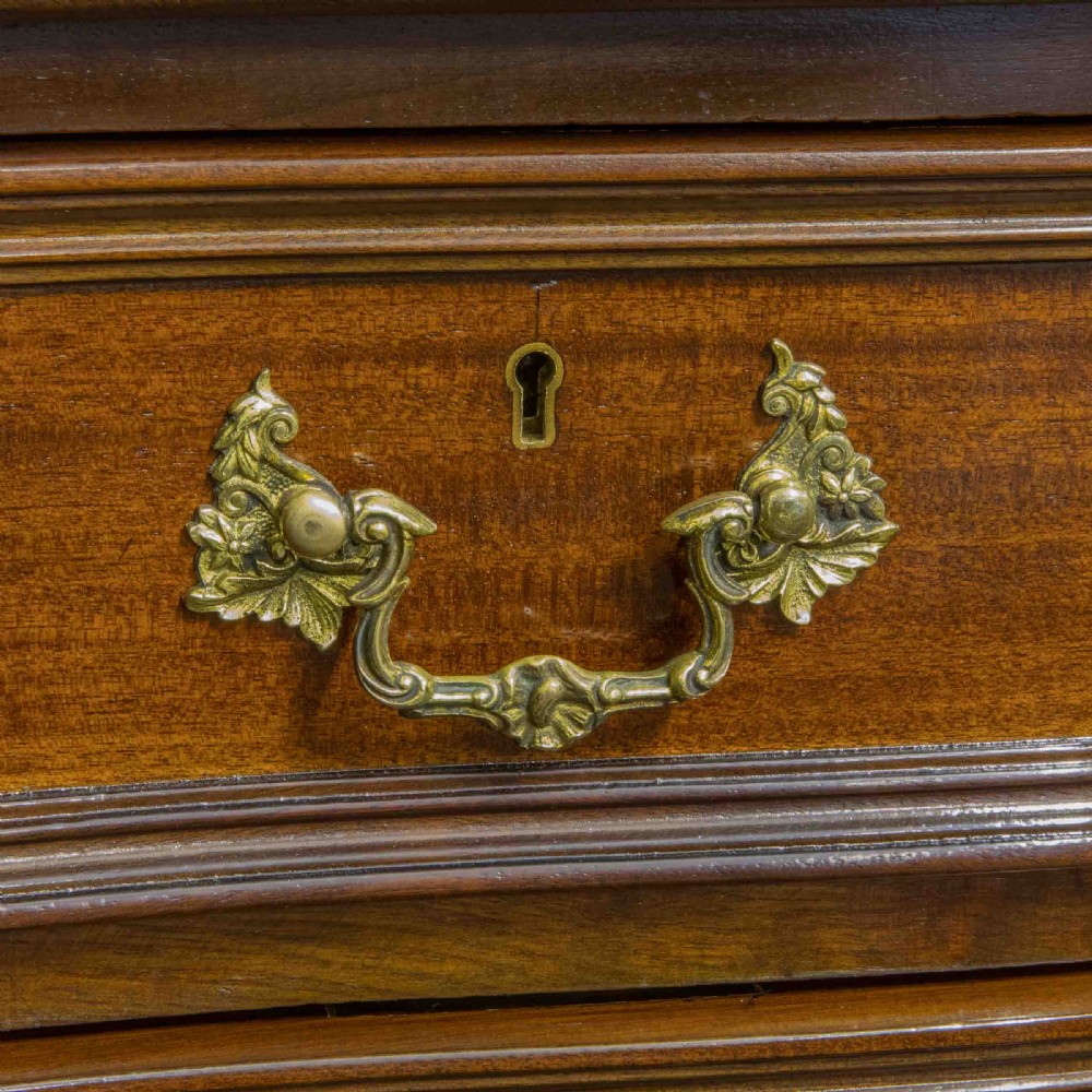 A Victorian carved mahogany dressing table featuring a central swing mirror, small upper jewellery drawers, lower storage drawers, and carved cabriole legs. View XI