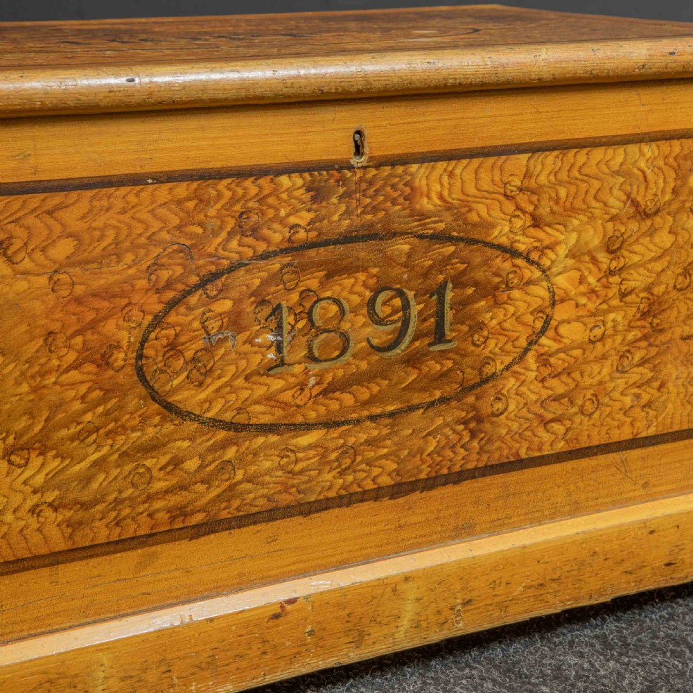 A Victorian pine storage box with a yellow-brown scrumbled painted finish, featuring the word HOPE on the lid and the year 1891 within an oval frame on the front. View II