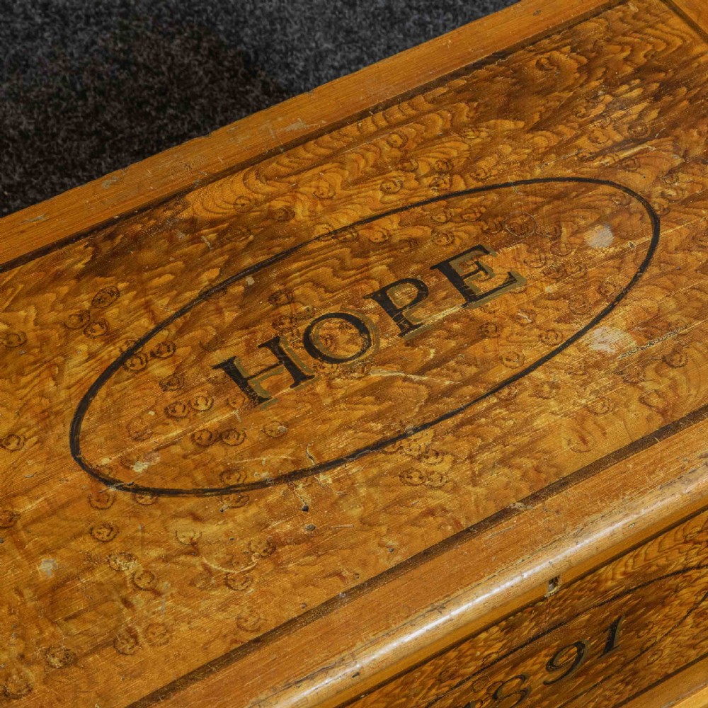 A Victorian pine storage box with a yellow-brown scrumbled painted finish, featuring the word HOPE on the lid and the year 1891 within an oval frame on the front. View III