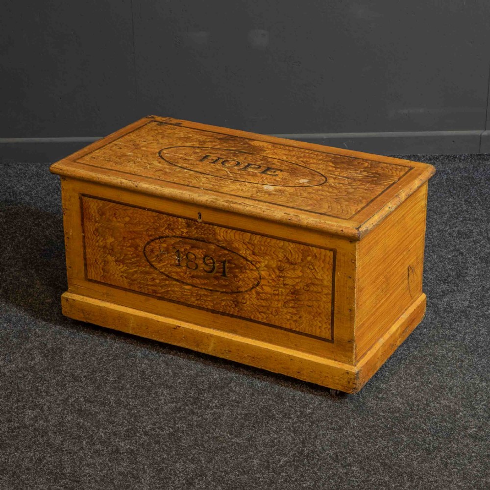 A Victorian pine storage box with a yellow-brown scrumbled painted finish, featuring the word HOPE on the lid and the year 1891 within an oval frame on the front. View IX
