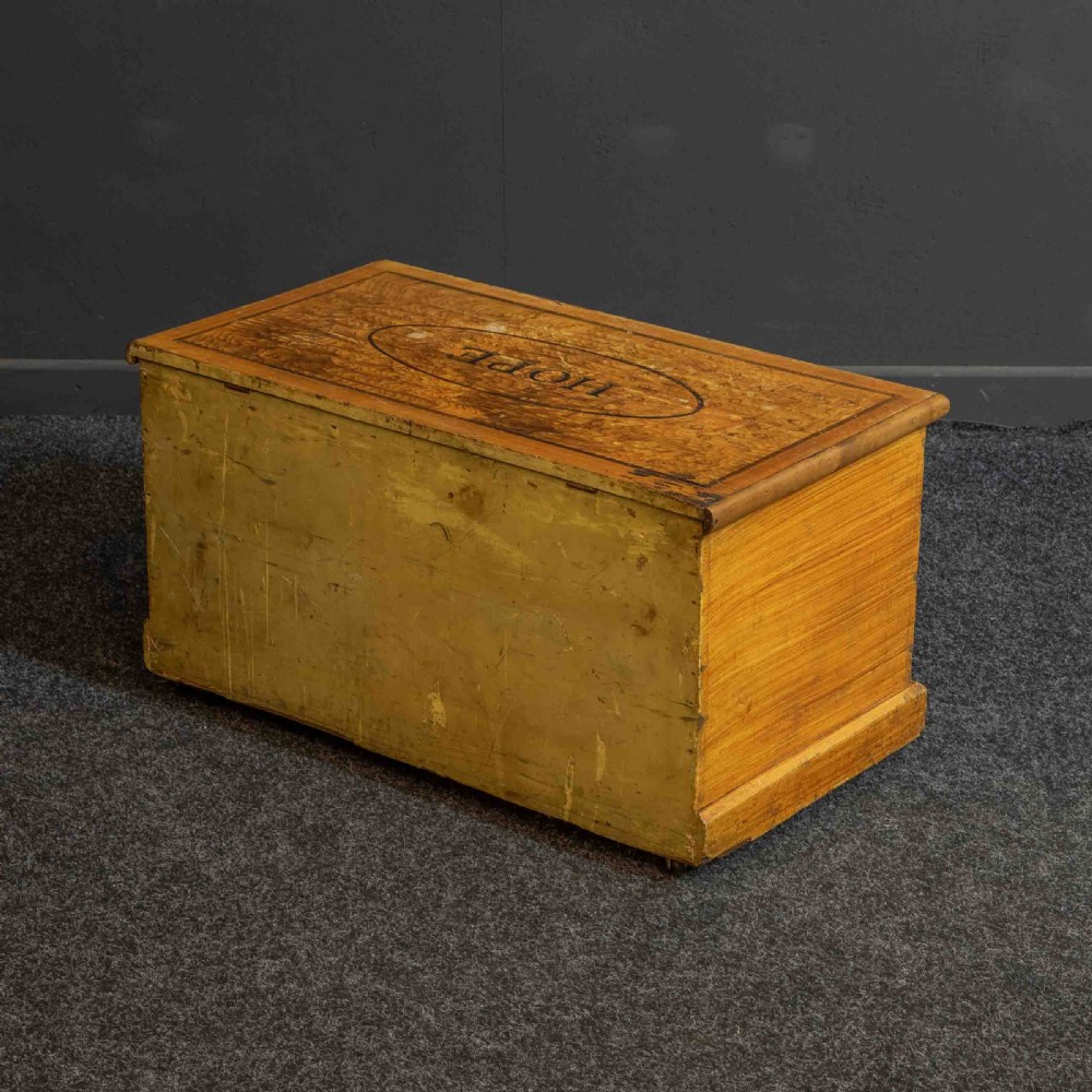 A Victorian pine storage box with a yellow-brown scrumbled painted finish, featuring the word HOPE on the lid and the year 1891 within an oval frame on the front. View X