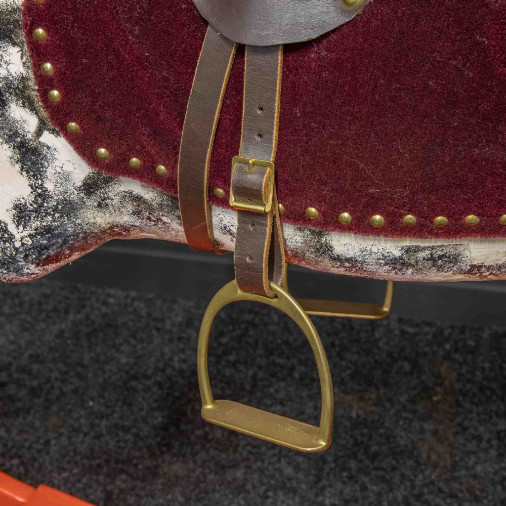 An antique Victorian hand-painted dappled grey wooden rocking horse with a leather saddle and horsehair mane mounted on an orange bow rocker. View IV