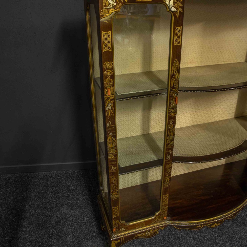 An antique dark timber Chinoiserie display cabinet featuring gold lacquered oriental scenes, glazed side panels, and carved cabriole legs with ball and claw feet. View IV