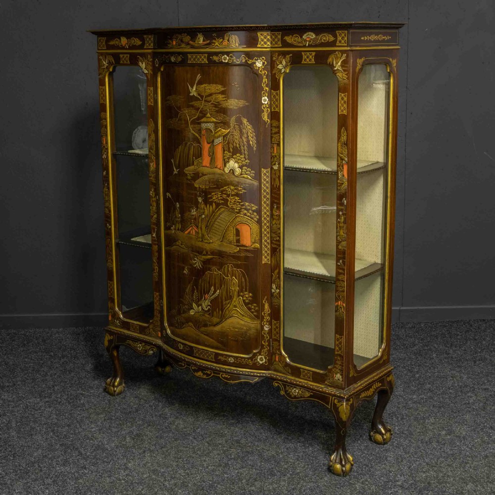 An antique dark timber Chinoiserie display cabinet featuring gold lacquered oriental scenes, glazed side panels, and carved cabriole legs with ball and claw feet. View V