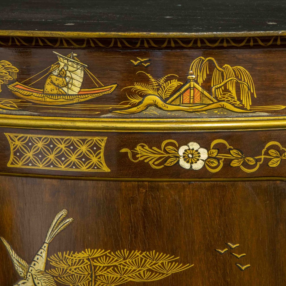 An antique dark timber Chinoiserie display cabinet featuring gold lacquered oriental scenes, glazed side panels, and carved cabriole legs with ball and claw feet. View IX