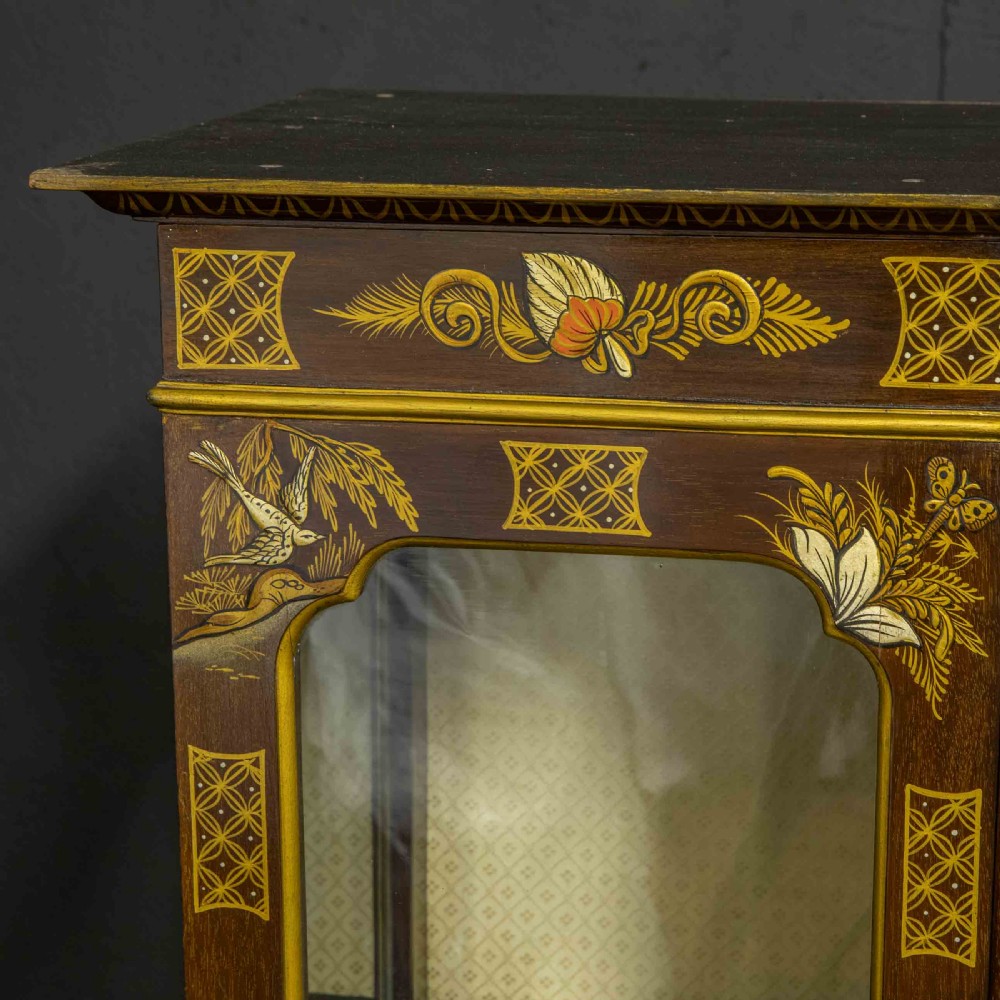 An antique dark timber Chinoiserie display cabinet featuring gold lacquered oriental scenes, glazed side panels, and carved cabriole legs with ball and claw feet. View XI