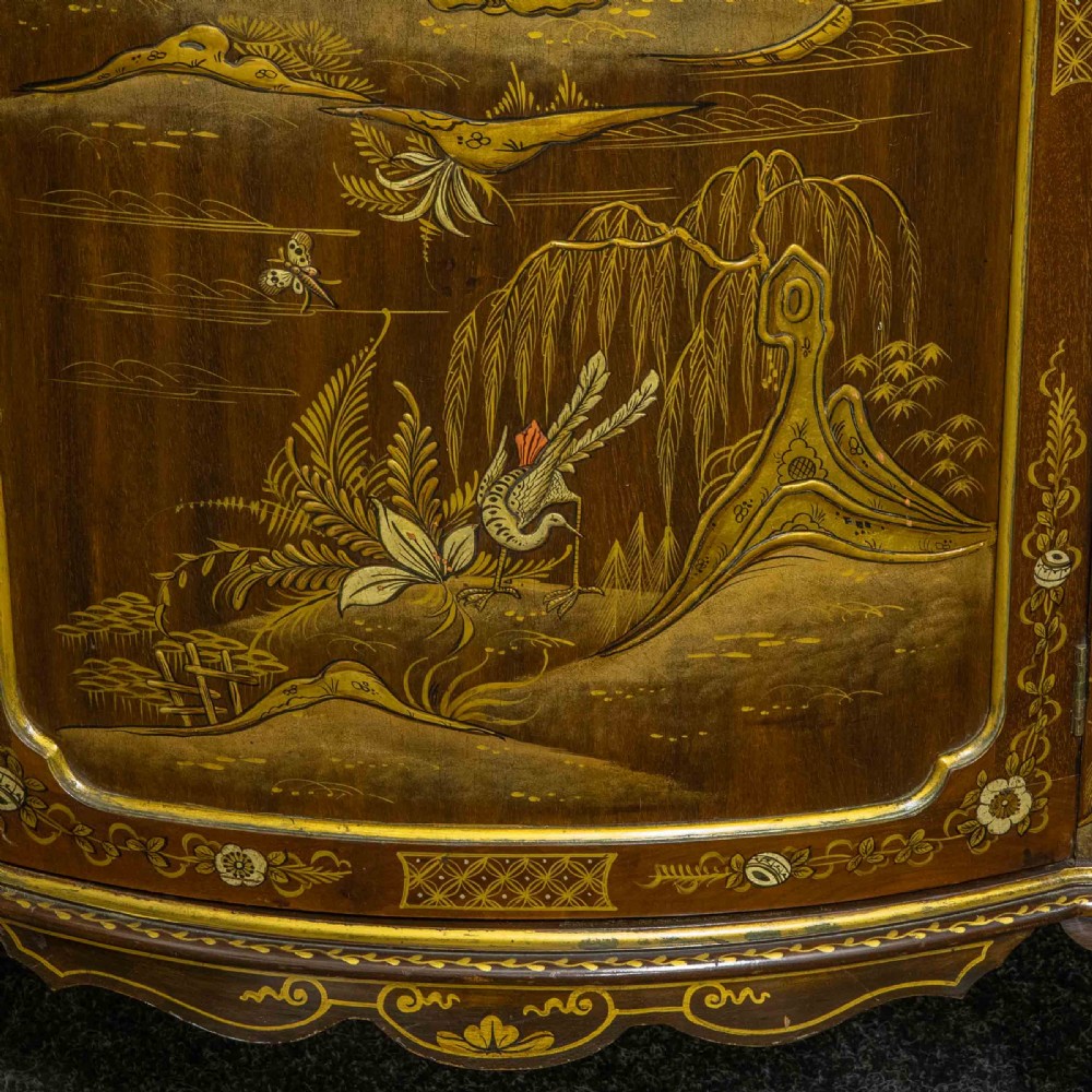 An antique dark timber Chinoiserie display cabinet featuring gold lacquered oriental scenes, glazed side panels, and carved cabriole legs with ball and claw feet. View XIV