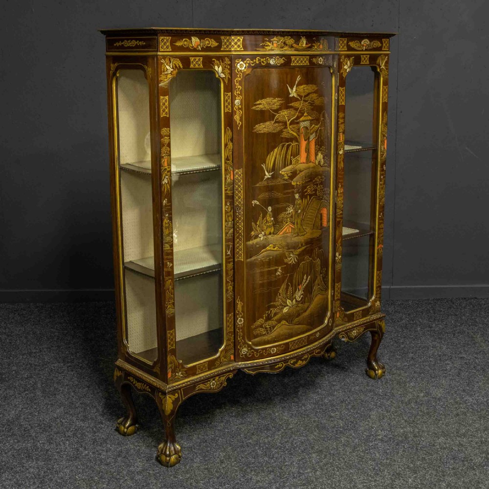 An antique dark timber Chinoiserie display cabinet featuring gold lacquered oriental scenes, glazed side panels, and carved cabriole legs with ball and claw feet. View XV