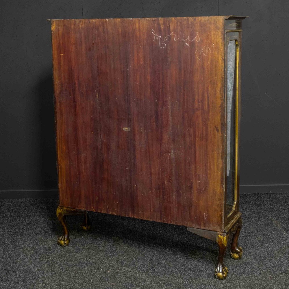 An antique dark timber Chinoiserie display cabinet featuring gold lacquered oriental scenes, glazed side panels, and carved cabriole legs with ball and claw feet. View XVII
