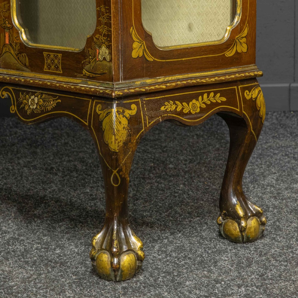 An antique dark timber Chinoiserie display cabinet featuring gold lacquered oriental scenes, glazed side panels, and carved cabriole legs with ball and claw feet. View XIX