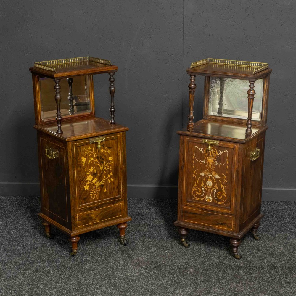 A pair of Edwardian inlaid rosewood bedside cabinets featuring brass gallery tops, mirrored upper shelves with turned pillars, and floral marquetry doors.