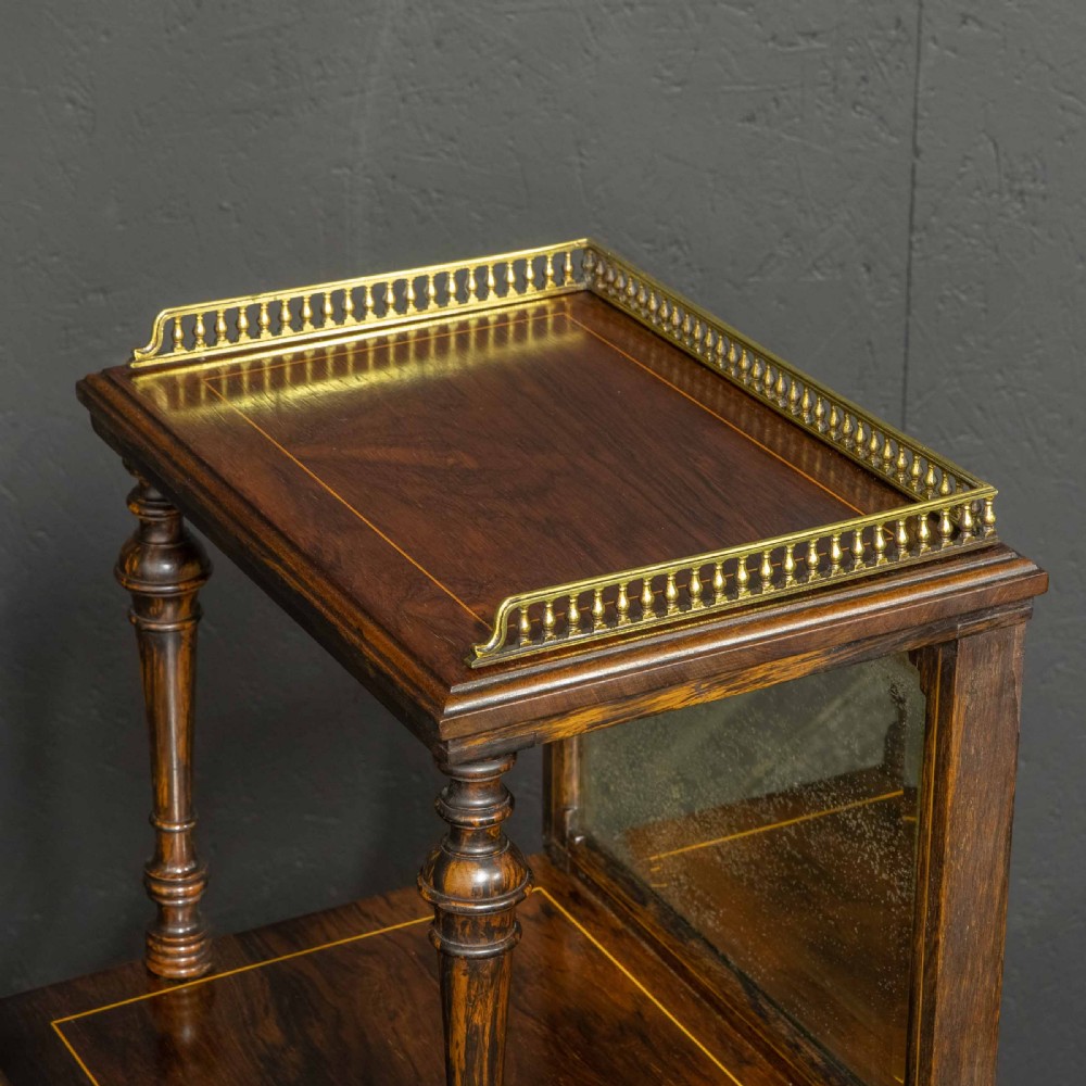 A pair of Edwardian inlaid rosewood bedside cabinets featuring brass gallery tops, mirrored upper shelves with turned pillars, and floral marquetry doors. View V