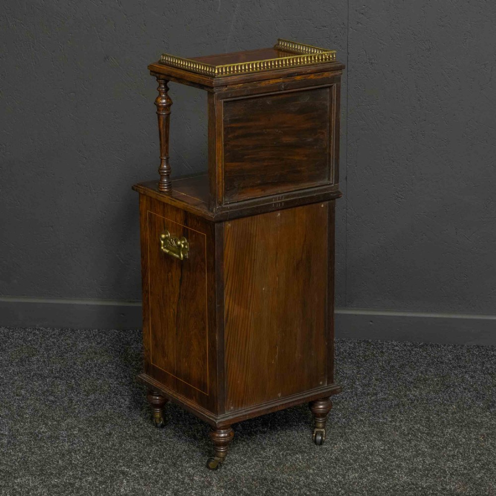 A pair of Edwardian inlaid rosewood bedside cabinets featuring brass gallery tops, mirrored upper shelves with turned pillars, and floral marquetry doors. View VII
