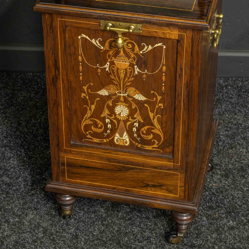 A pair of Edwardian inlaid rosewood bedside cabinets featuring brass gallery tops, mirrored upper shelves with turned pillars, and floral marquetry doors. View X