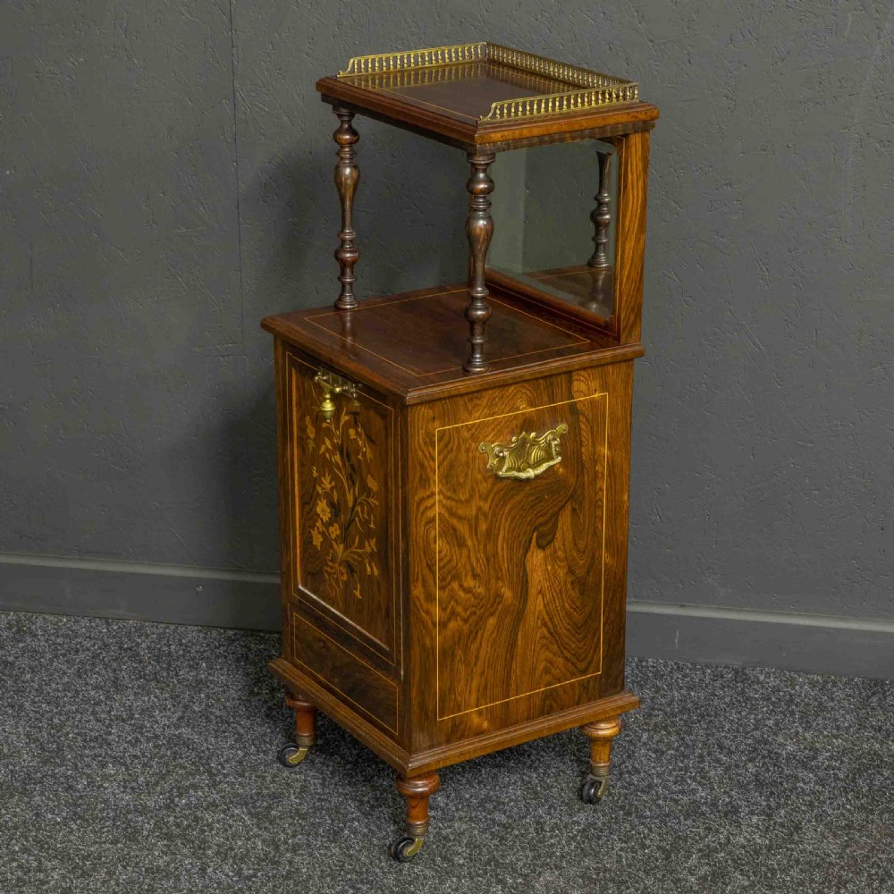 A pair of Edwardian inlaid rosewood bedside cabinets featuring brass gallery tops, mirrored upper shelves with turned pillars, and floral marquetry doors. View XI