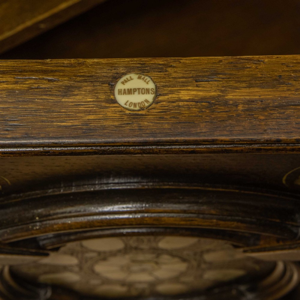 A dark oak Jacobean dresser featuring geometric mouldings, mother-of-pearl inlays, arched panels, turned split spindles, and lower drawers. View XIII