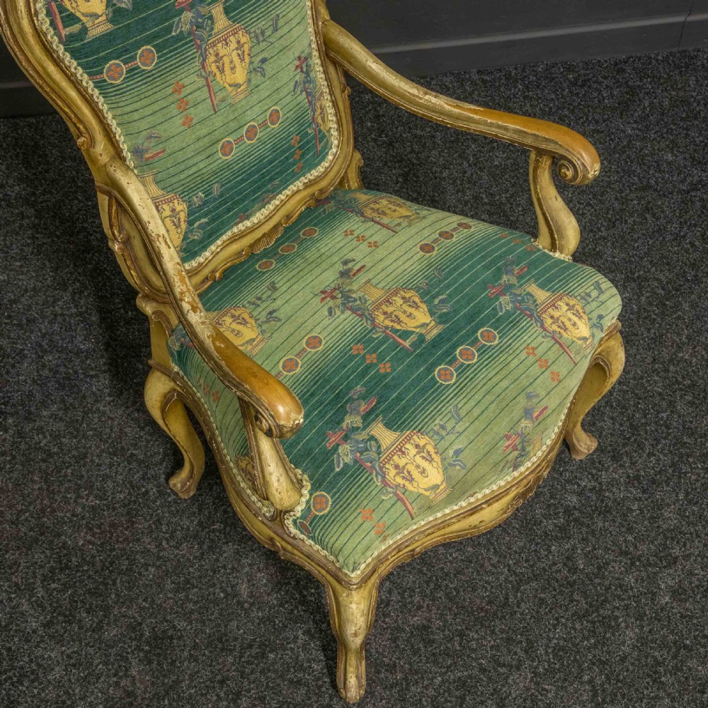 A 19th-century French giltwood fauteuil open armchair featuring carved shell motifs, cabriole legs, and patterned green upholstery. View VII