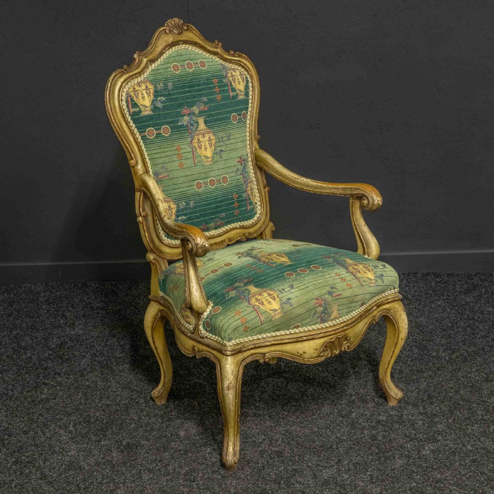 A 19th-century French giltwood fauteuil open armchair featuring carved shell motifs, cabriole legs, and patterned green upholstery. View VIII