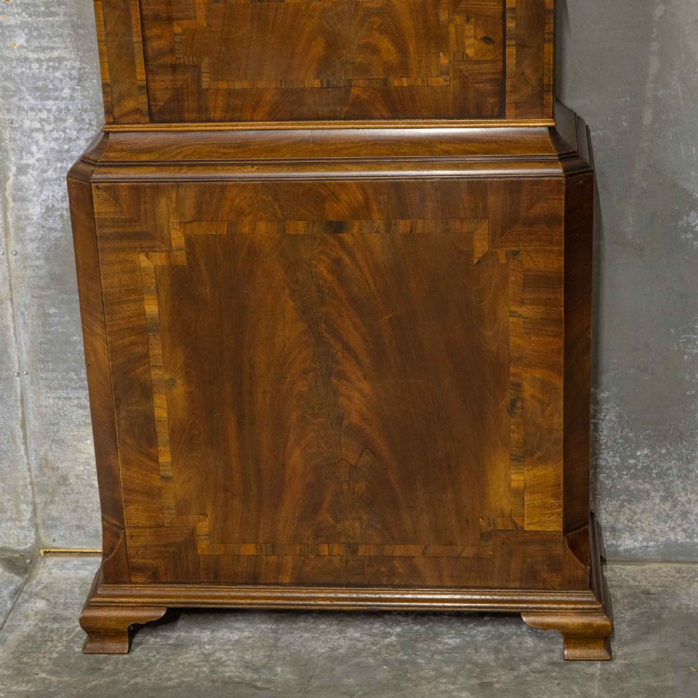A Georgian mahogany longcase clock featuring a swan-neck pediment with a brass finial, spiral quarter columns, and a hand-painted arch dial. View III