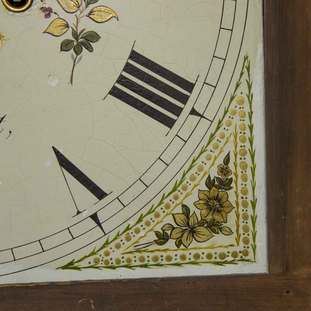 A Georgian mahogany longcase clock featuring a swan-neck pediment with a brass finial, spiral quarter columns, and a hand-painted arch dial. View XIII