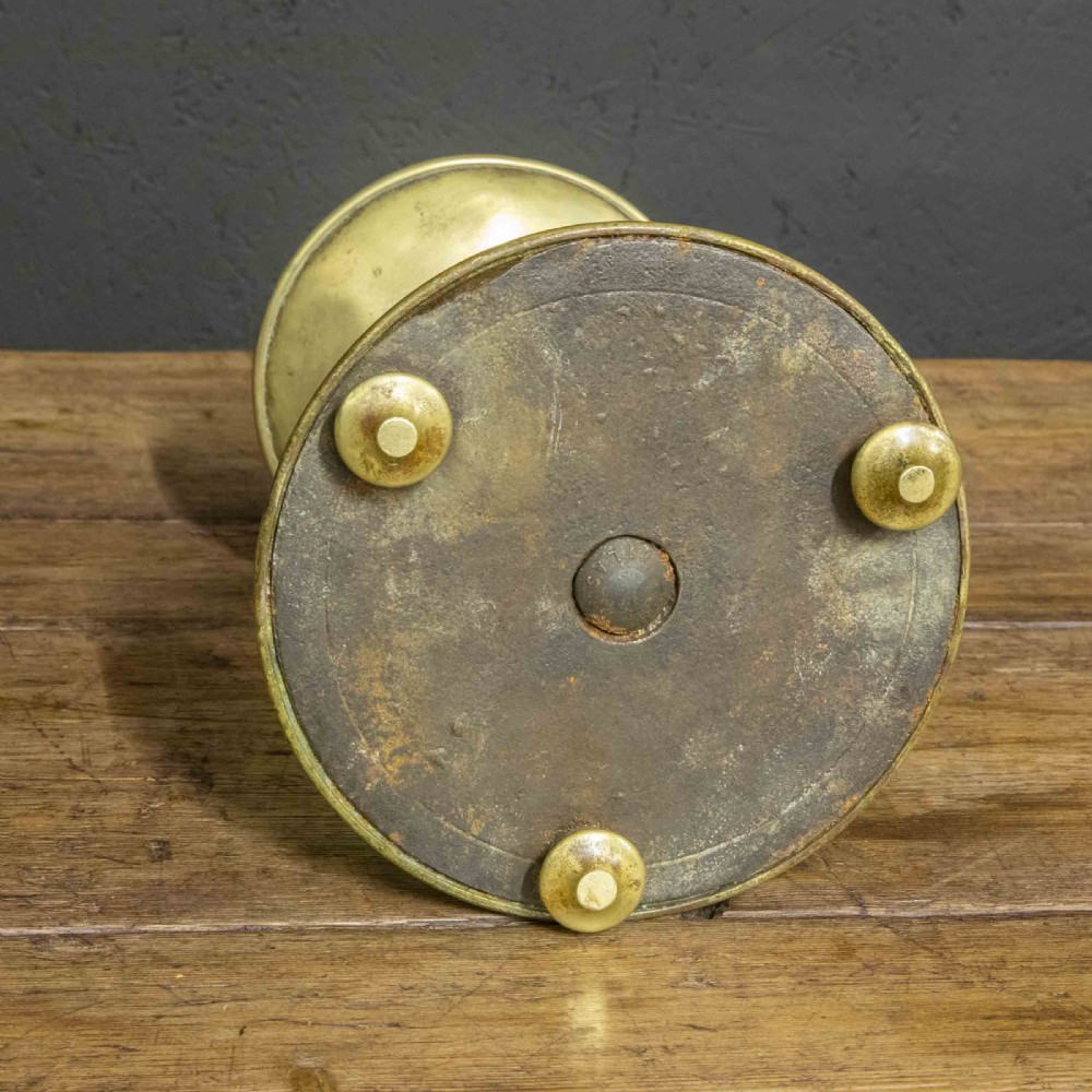 A pair of Victorian solid brass pricket candlesticks featuring wide circular drip pans, turned knopped stems, and broad bell-shaped bases. View XII