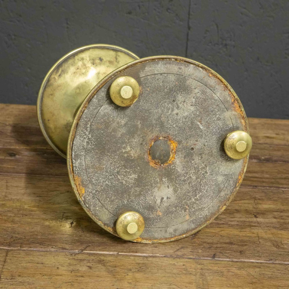 A pair of Victorian solid brass pricket candlesticks featuring wide circular drip pans, turned knopped stems, and broad bell-shaped bases. View XIII