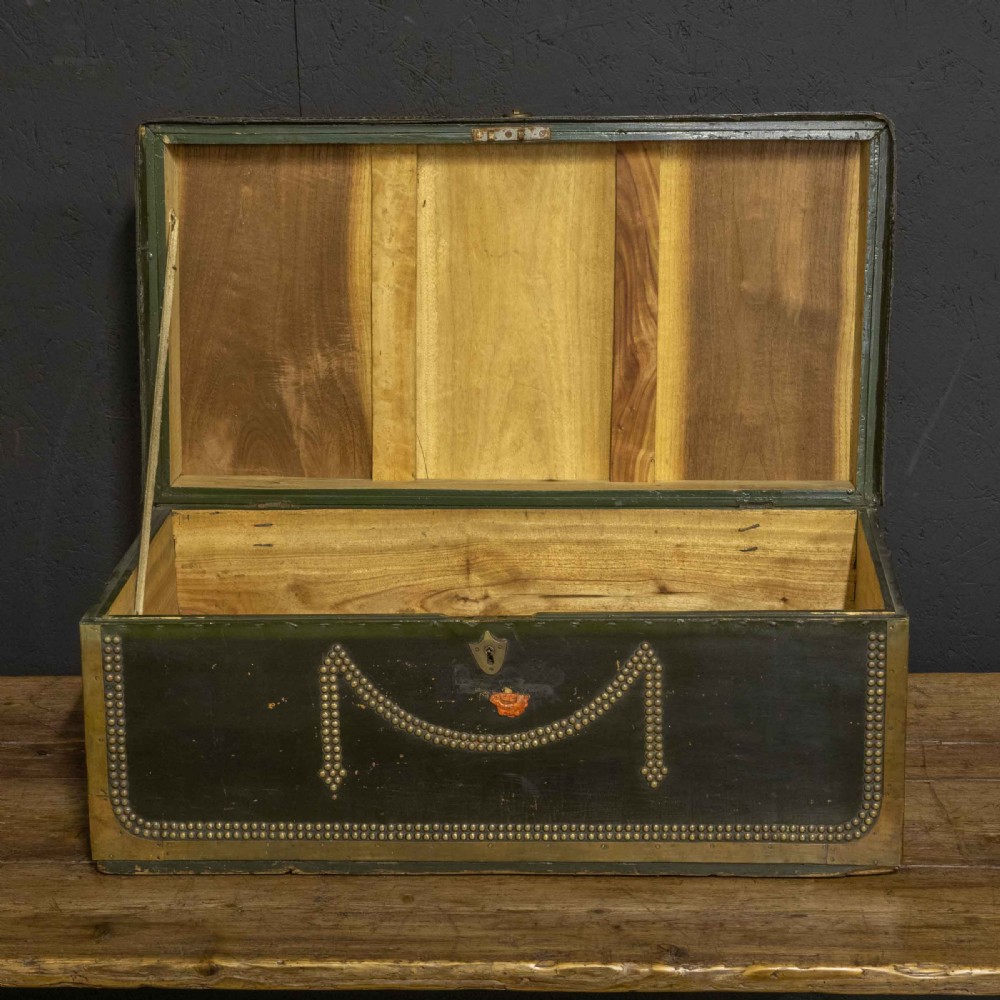 An early nineteenth-century dark green leather coaching trunk featuring brass stud embellishments in a festoon pattern and side carrying handles. View III