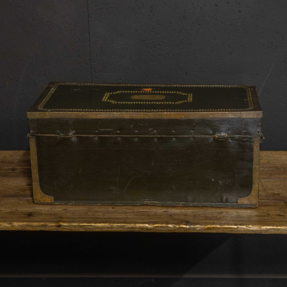An early nineteenth-century dark green leather coaching trunk featuring brass stud embellishments in a festoon pattern and side carrying handles. View VI