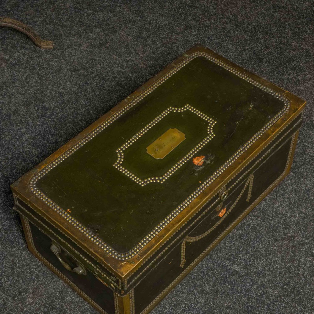 An early nineteenth-century dark green leather coaching trunk featuring brass stud embellishments in a festoon pattern and side carrying handles. View IX