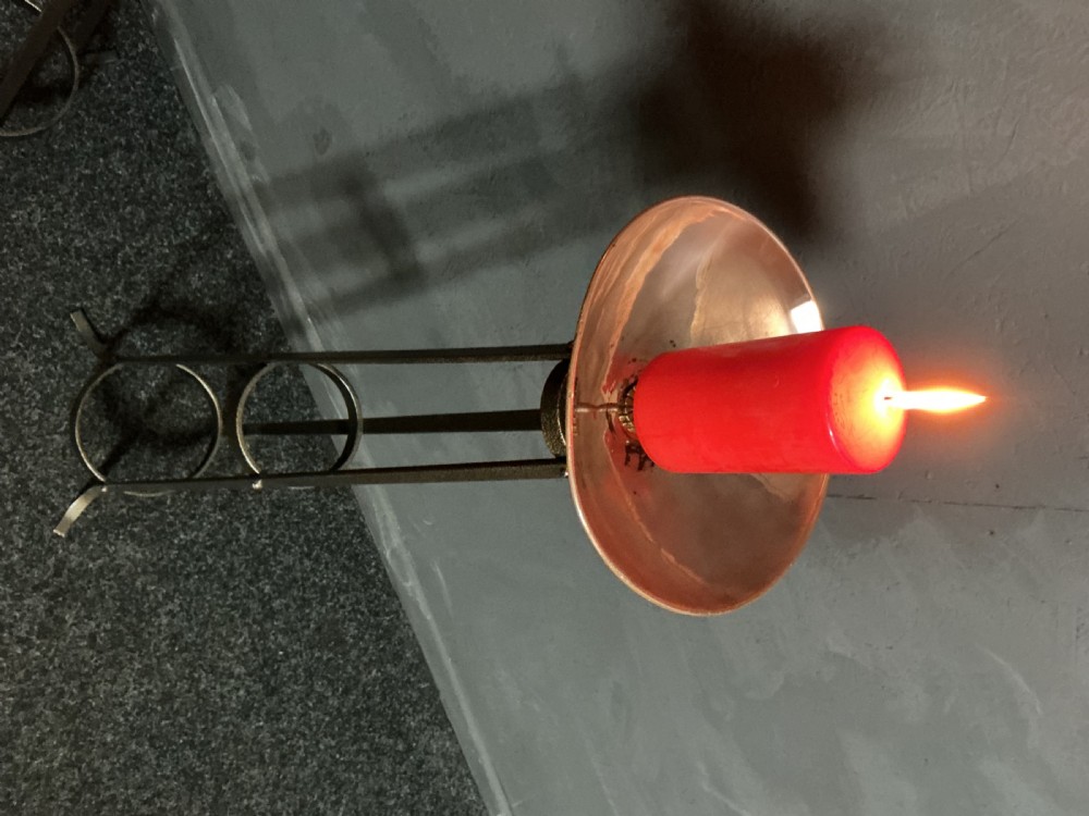 A pair of tall dark metal Art Deco floor torcheres with slender tripod frames and wide candle dish tops. View IV