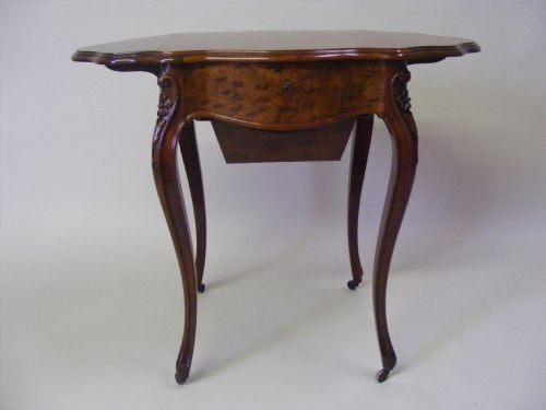 A Napoleon III Plum Pudding Mahogany Work Table.